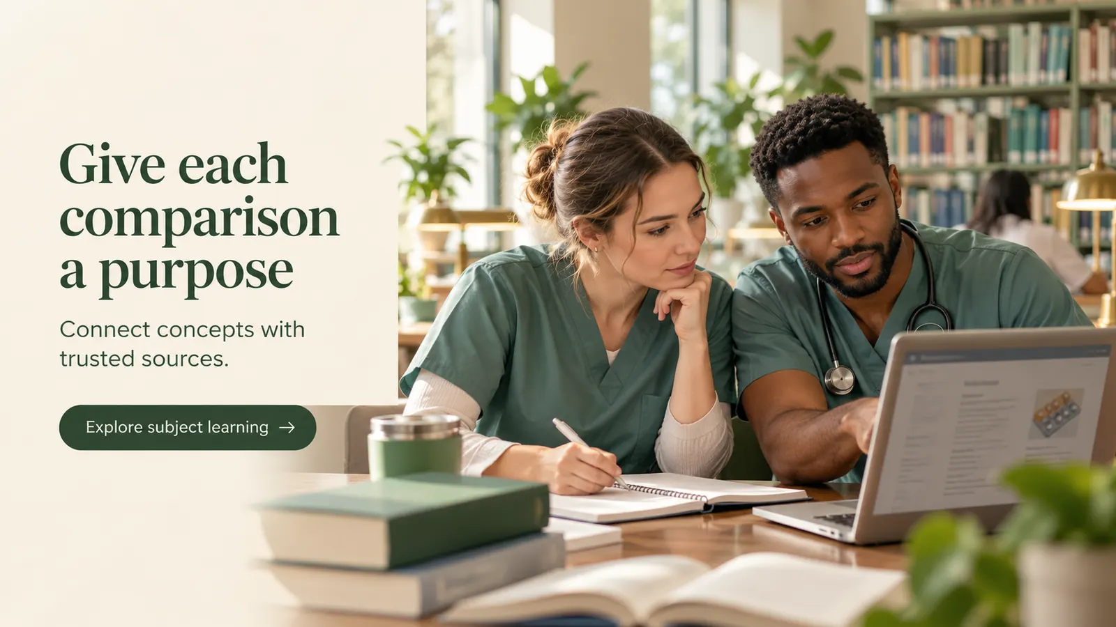 Two healthcare learners checking a reference page on a laptop during pharmacology study